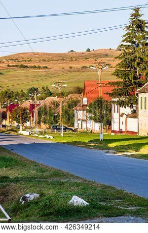 View Of Picturesque Village Viscri In Romania. Painted Traditional Old Houses In Medieval Saxon Vill
