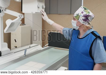 The Work Of A Radiologist In The X-ray Room For Diagnostics.