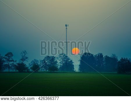 A Summer Sun Rising In A Very Hazy Morning With Lots Of Dust Particles In The Air. Misty Sunrise. Su