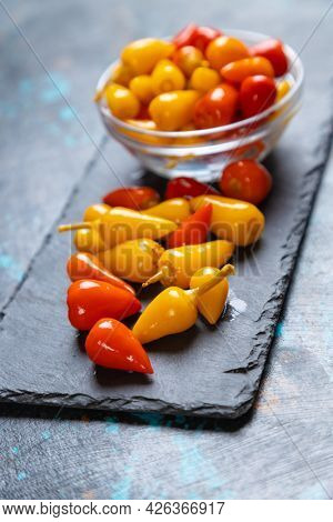 Pickled red and yellow hot chili peppers
