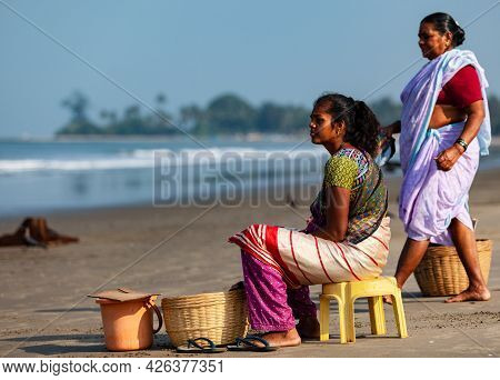 Morjim, North Goa, India , 01 April 2016 Indian Women On The Shore Gaze At The Ocean
