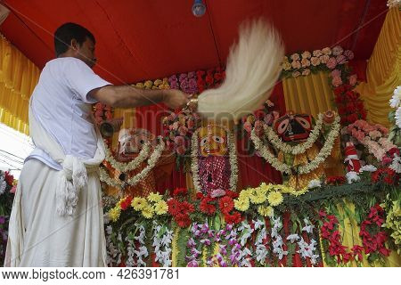 Howrah, West Bengal, India - 7th July 2019 : Hindu Priest Worshipping Idol Of God Jagannath, Balaram