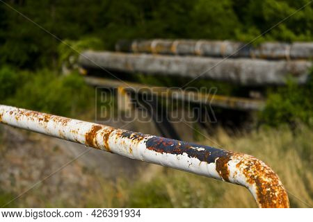 Rusty Iron Banister In A Bridge Near The Forest