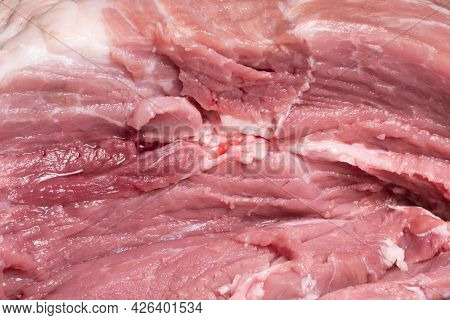 Slice The Pork Or Beef With A Knife On The Table In Close-up.preparation Of Meat Dishes And Food Pro