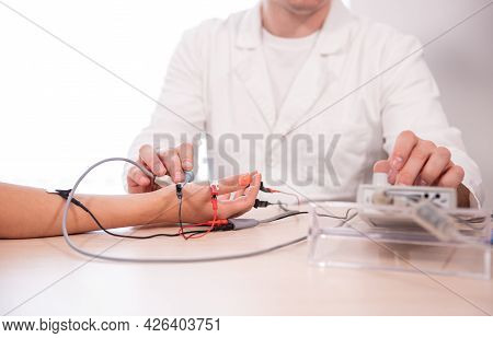 Patient Nerves Testing Using Electromyography At Medical Center