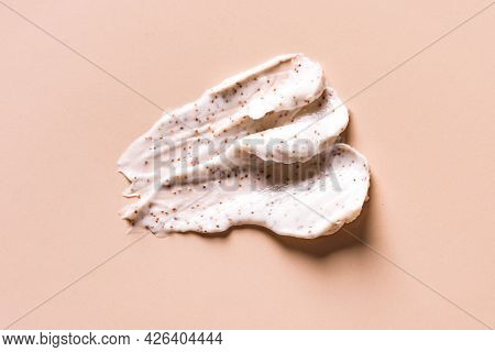 Sample Of Natural Scrub On Nude Pink Background. Peeling Cream With Microcapsules. Peach Or Coffee S