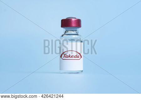 Vials Of Liquid On A White Table And The Logo Takeda, Large Pharmaceutical Company. March 15, 2021. 