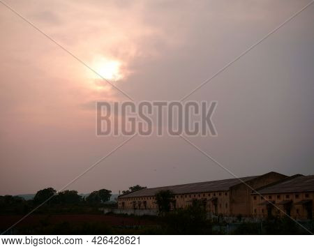 Food Corporation Godown View At Forest Area With Amazing Sunset Background.