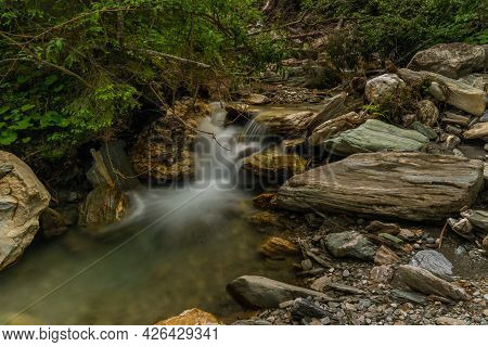 Nice Color Clean Creek Near Huttschag Village In Summer Hot Day