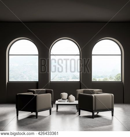 Interior Of Dark Waiting Room Of Chololate Shade. Four Armchairs, Coffee Table With White Top. Three