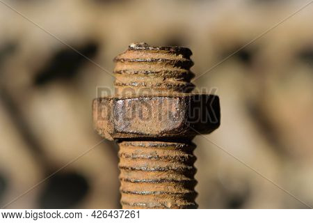 Old Rusty Bolt, Iron Rod With Screw Threads. Rusted Mechanical Components. Threaded Bolt And Nut Iso