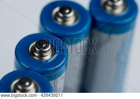 Macro Photo Of Batteries For Electronic Devices On A White Background.
