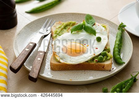 Avocado Toast With Fried Eggs And Fresh Green Peas, Ccoffee Cups. Healthy Breakfast, Keto Food. Diet