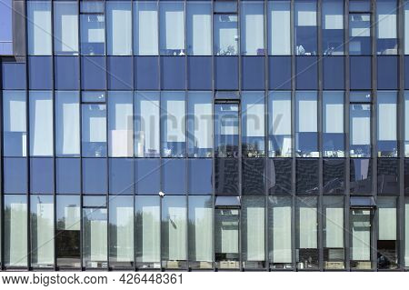 A Fragment Of The Glass And Sandstone Facade Of A Modern Office Building. Wide Abstract Fragment Of