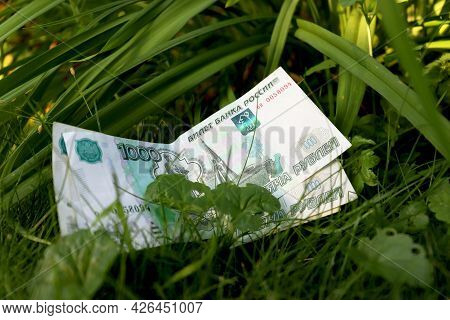 Green Money On A Green Background. Banknote One Thousand Russian Rubles. Cash Paper Money On A Backg
