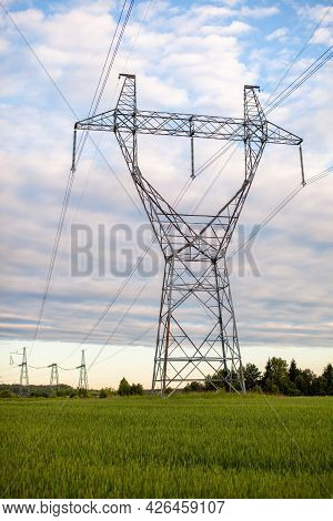 Metal Poles Electric Supports For High-voltage Wires In The Fields In The Summer.high Voltage Poles 