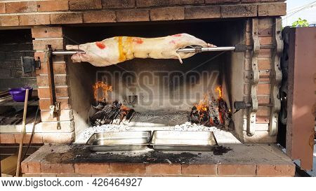 Spit Roasted Lambs, Traditional Way Of Roasting Lambs On A Rotisserie Spit In Bulgaria. Cheverme..