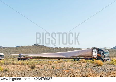 Matjiesfontein, South Africa - April 20, 2021: Close-up Of A Truck With The Blade Of A Wind Turbine 