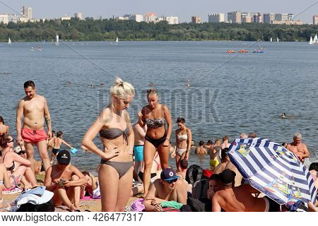 Moscow, Russia - July 2021: Crowd Of People Tanning On A Beach Of Moscow River In Strogino On City B