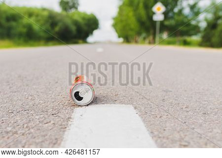 Aluminum Can Is Flat Lay,lying On The Road. Can Fall On The Street, It Can Be Recycled.summer Day Bl