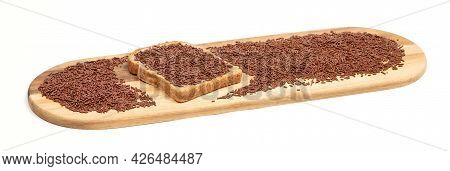 Typical Dutch Chocolate Sprinkles (hagelslag) On A Slice Of Bread, Served On A Wooden Plate, Isolate
