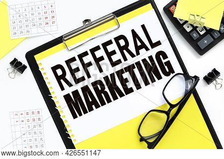 Refferal Marketing, Text On White Paper. On The Black Folder. Near The Calendar