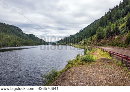 Cheybekkel Mountain Lake Is Surrounded By Mountains And Coniferous Taiga. Ulagan District Of The Alt