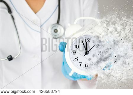 Yearly Health Check Up. Ambulance. Healthcare. Stethoscope And Dissolving Alarm Clock In Medical Han