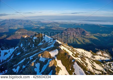 Aerial View Over Ciucas Mountains, Ciucas Peak, Romania, Europe. Morning Light At Sunrise