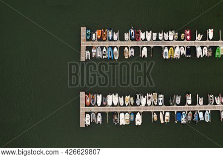 Aerial View Of A The Jetty Of A Sailing Club In Helford, Cornwall Full Of Small Boats