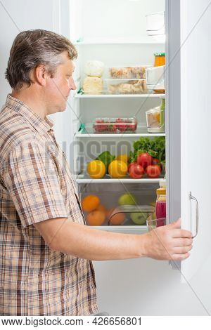 The Mature Men At Fridge  With Food