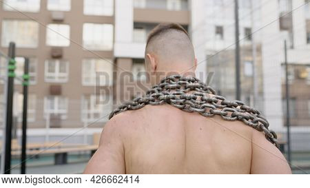 Athlete And Training Chain. Fight For Fitness. Fit Man With Metal Chain. Athletic Guy With Muscular 