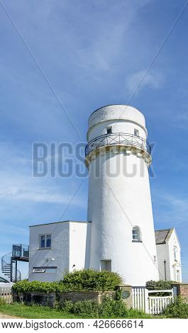 Old Hunstanton, Norfolk, England - June 13 2021. White Lighthouse Vertically.
