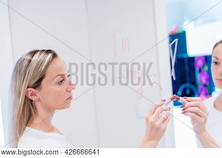 The Woman Writes The Words Im Sorry On The Mirror With Red Lipstick.