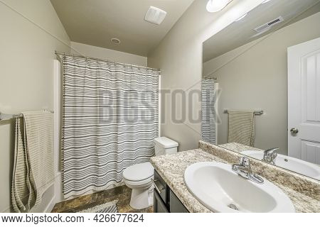 Traditional Bathroom Interior With Limestone Tiles And Sink