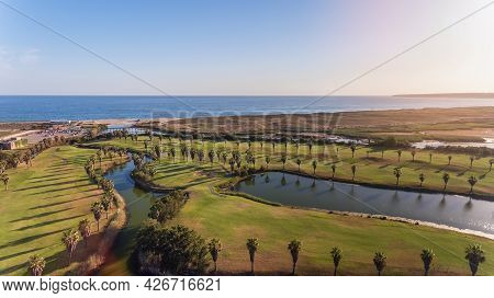 Green Golf Courses By The Sea. Salgados Beach. Portugal, Albufeira. Aerial View.