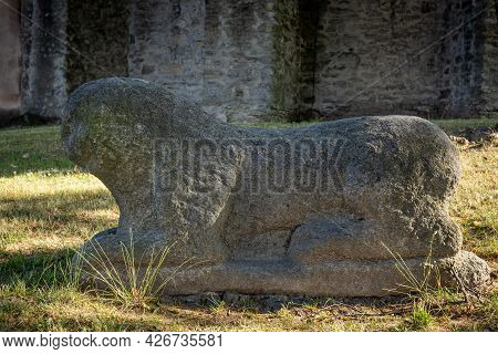 Stone Roman Lion Figure From 12th Century, Standing In Front Of St Anna Church, Sobotka. 6.07.2021.