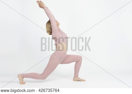 Yoga Concepts. Portrait Of Senior Caucasian Woman Practicing Yoga Asana Pose In Professional Sport G