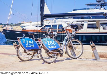 Malta's Public Bicycle Sharing Dock Station In Birgu. Bicycle Share Program In Malta Gives Residents