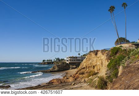 The View Of The San Clemente Waterfront At Sunrise During A Cloudless Day Featuring Rocky Beaches, T
