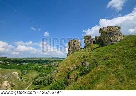 View to limestone toltres, rock residues of ancient coral reefs of dried Sarmatian sea at the North of Moldova
