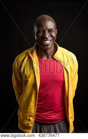 Portrait Of An African American Man Standing Looking At The Camera And Smiling