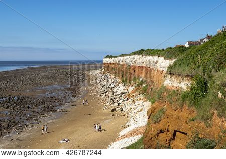Old Hunstanton, Norfolk, England - June 13, 2021. Hunstanton Cliffs On A Sunny Day With Some People 