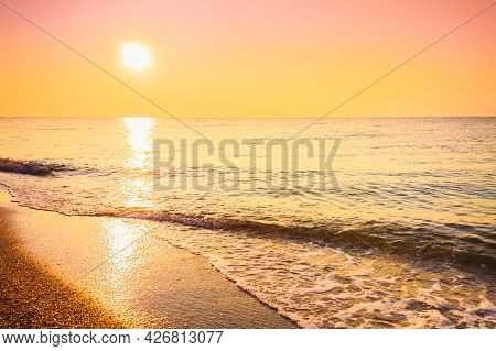 Soft Sea Ocean Waves Wash Over Golden Sand Background. Sunset, Sunise, Sun