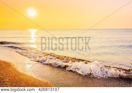 Soft Sea Ocean Waves Wash Over Golden Sand Background. Sunset, Sunise, Sun