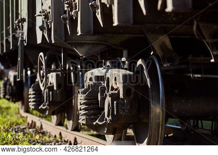 Close-up Of A Wheelset Spring On A Railway Boxcar. Power Railway Vehicles That Are Used For Transpor