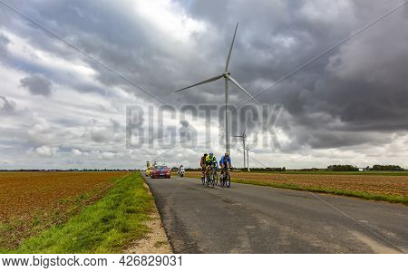 Le Gault-saint-denis, France - October 08, 2017: The Breakaway Riding On A Road In The Plain With Wi