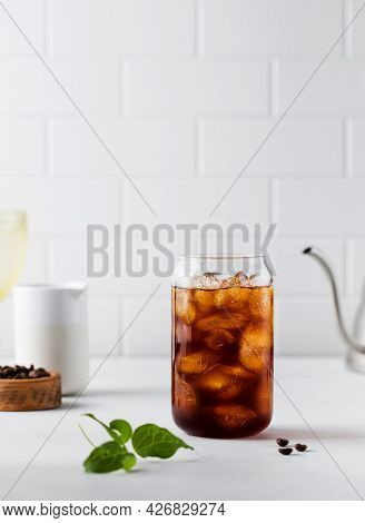 Cold Black Coffee With Ice Cubes On A White Background. Coldbrew. Summer Drinks.