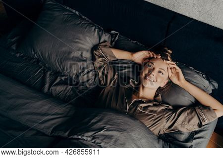 Image Of Young Beautiful Sleepy Girl In Satin Comfy Pajama Waking Up Stretching In Early Morning In 