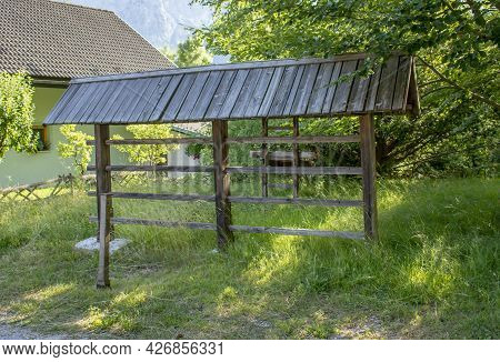 Traditional Slovenian Hayrack (kozolec). Wooden Construction For Drying Hay.